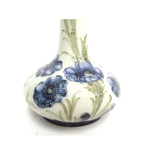 6669 - A Macintyre Moorcroft Florian Ware Poppy pattern vase, circa 1903-04, with blue flowers against a cr... 