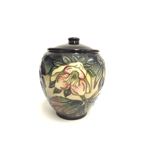 6666 - A Moorcroft Hellebore pattern lidded ginger jar, second, 15cm tall