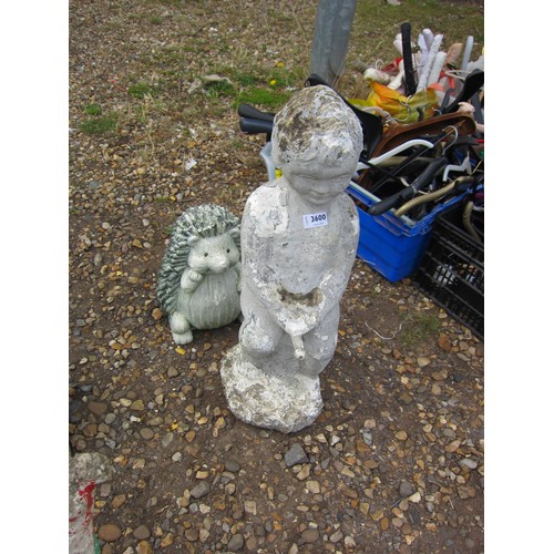 3600 - A composition figure of a boy holding his water spout and a hedgehog