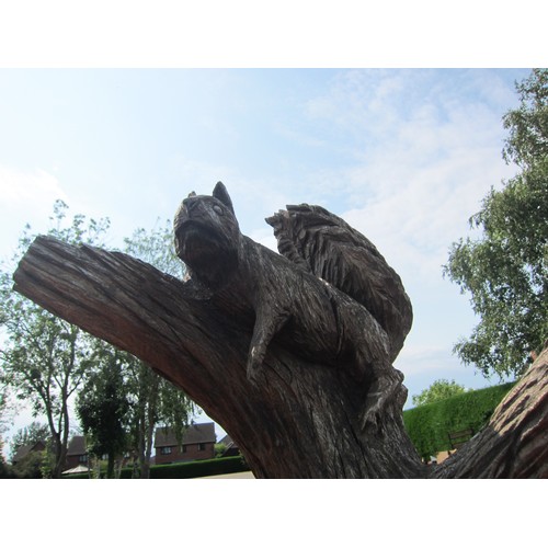 1056 - An Andy Barton tree trunk chainsaw carving with fox, pine marten and squirrel. Labelled at base. In ... 