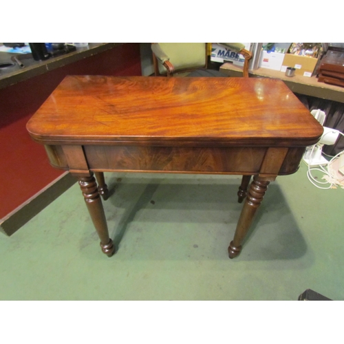 4001 - A Circa 1850 flame mahogany tea/side table the fold-over swivel top on turned and tapering legs, mis... 