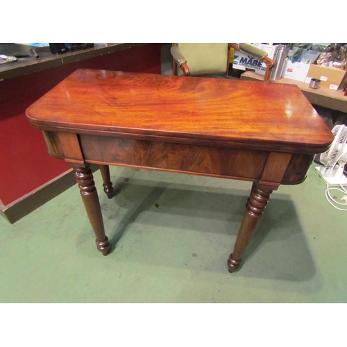 4001 - A Circa 1850 flame mahogany tea/side table the fold-over swivel top on turned and tapering legs, mis... 