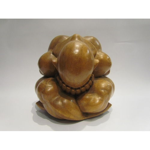 4008 - An Orang Malu Yogiman 'crying man' carved wood figure, 22cm tall