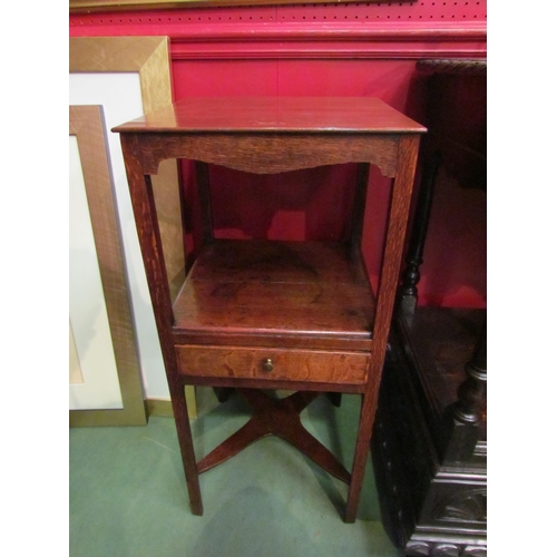 4049 - A George III oak gentleman's three tier washstand with central drawer and turned/chamfered supports ... 