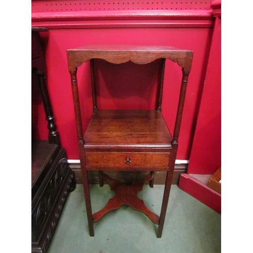 4061 - A George III mahogany gentleman's three tier washstand with central drawer over a flat X-stretcher, ... 