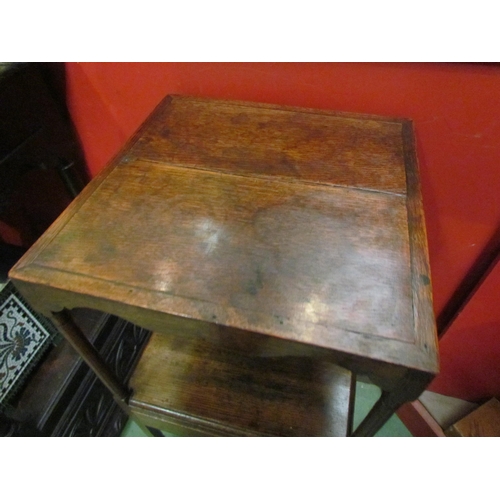 4061 - A George III mahogany gentleman's three tier washstand with central drawer over a flat X-stretcher, ... 