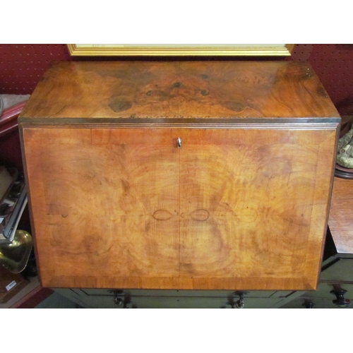 4072 - Circa 1930 a figured walnut writing bureau the fitted interior over four graduating drawers on brack... 