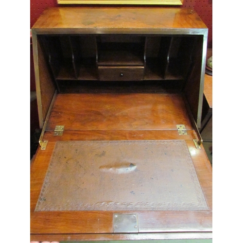 4072 - Circa 1930 a figured walnut writing bureau the fitted interior over four graduating drawers on brack... 