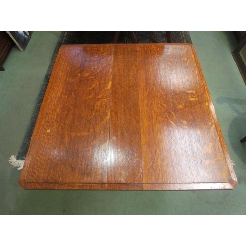 4090 - An Arts & Crafts oak coffee table, in the manner of Liberty's, raised on brass castors, 56cm tall x ... 