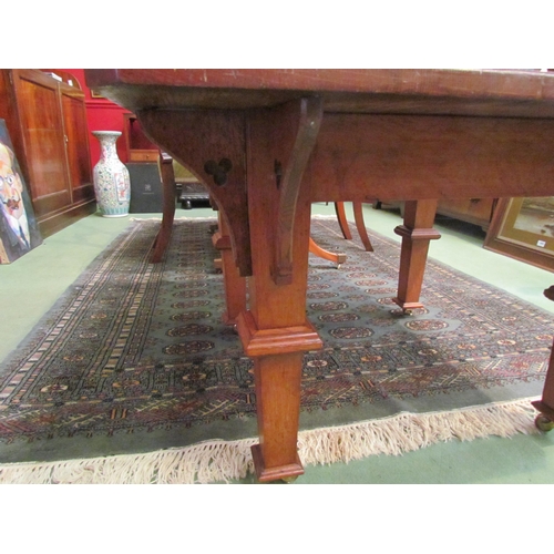 4090 - An Arts & Crafts oak coffee table, in the manner of Liberty's, raised on brass castors, 56cm tall x ... 