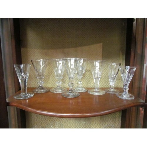 4092 - Eight early 19th Century drinking glasses, each with facet cut bowls, plain, blade and rounded knop ... 