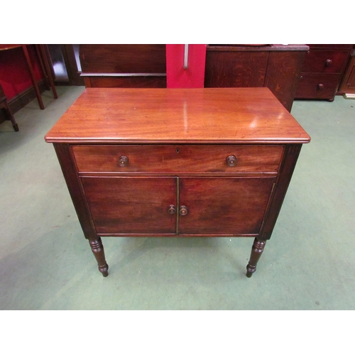 4117 - A George III mahogany side cabinet the single drawer over a two door cupboard on ring turned taperin... 