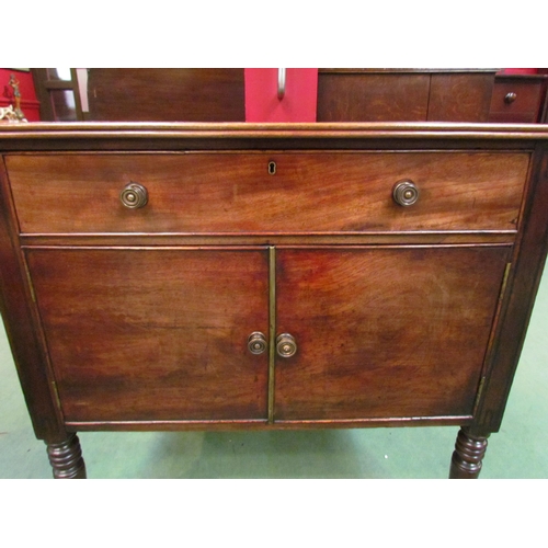 4117 - A George III mahogany side cabinet the single drawer over a two door cupboard on ring turned taperin... 