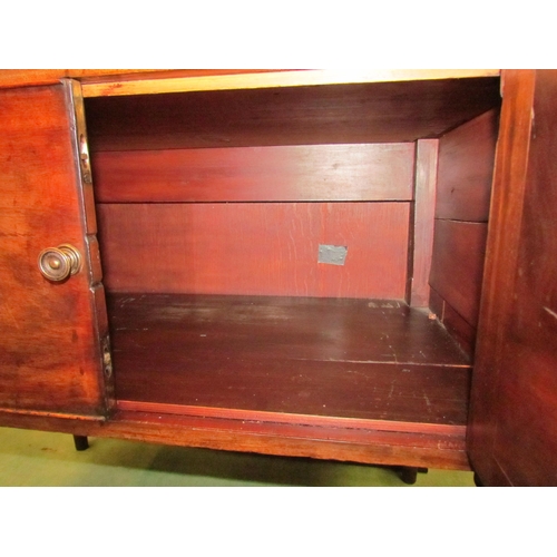 4117 - A George III mahogany side cabinet the single drawer over a two door cupboard on ring turned taperin... 