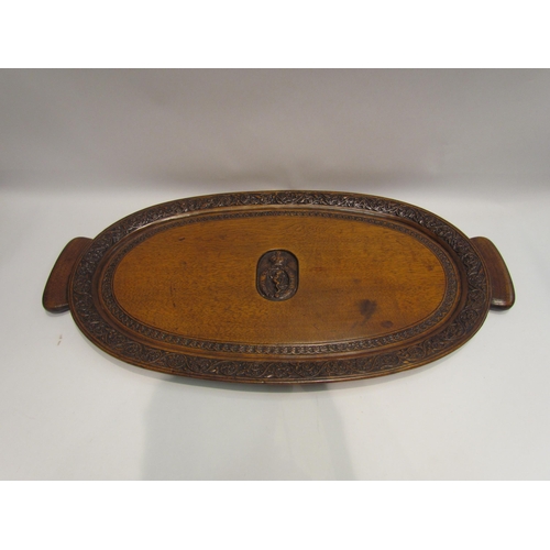 4129 - A military carved oak tray 