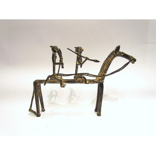 4149 - A metal sculpture of two figures riding a horse, possibly Dogon, 18cm tall