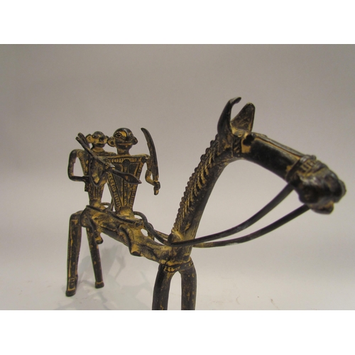 4149 - A metal sculpture of two figures riding a horse, possibly Dogon, 18cm tall