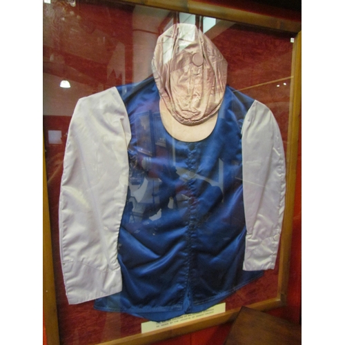 4160 - Framed horse racing silks bearing label 