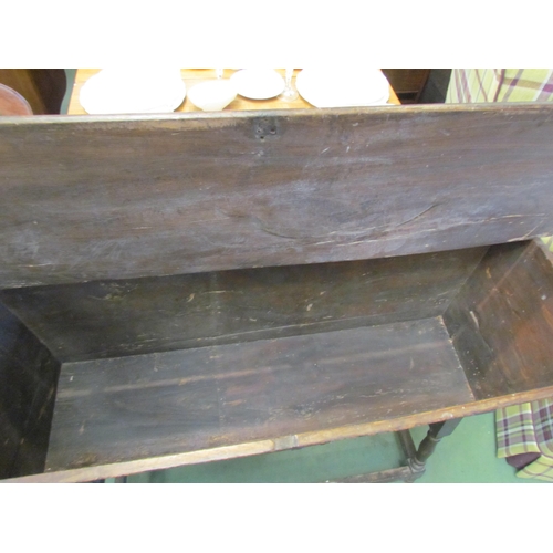 4211 - A 19th Century carved oak dough bin, raised on turned supports joined by a stretcher, 80cm tall x 12... 