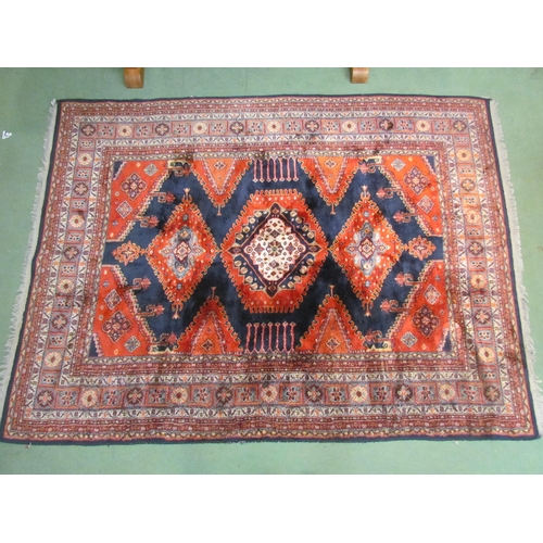 4540 - A Persian wool carpet, red ground, central gul, multiple borders, 230cm x 170cm