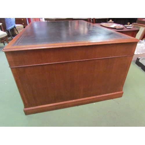 4121 - A large medium oak twin pedestal 'Partners' desk of eight drawers and opposing two single door cupbo... 