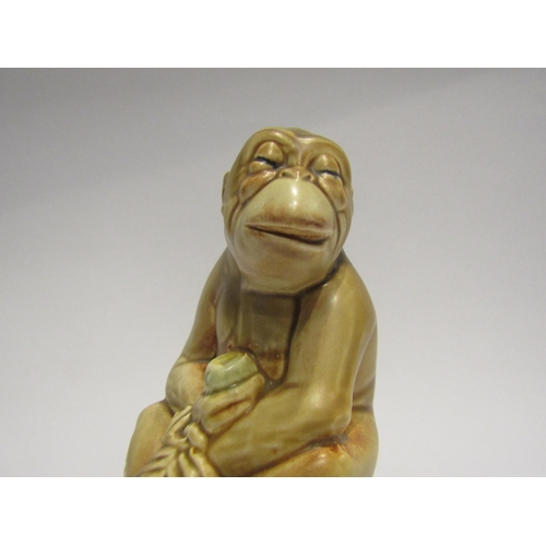 4370 - A Beswick Ware figure of a seated monkey on black base, model no 397, 18cm tall