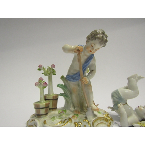 4371 - A Meissen figurine cherub gardener, blue cross swords to base, and a similar figurine of a tumbling ... 