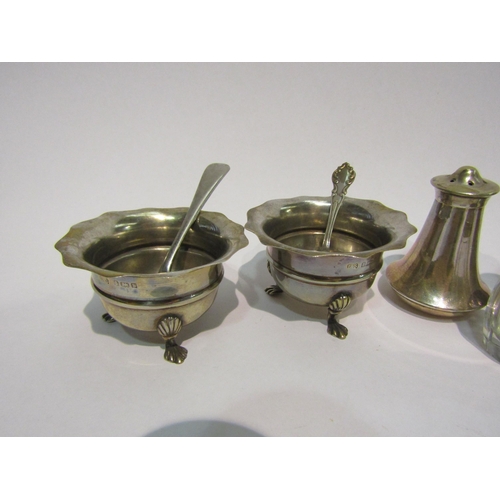 4388 - Two silver salts with matched spoons, one silver, together with four plated pepperettes