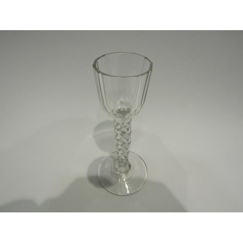 4391 - An 18th Century cordial glass with facet stem and bowl. 13.5cm high