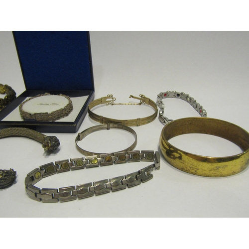 4395 - A bag containing bracelets and bangles including silver