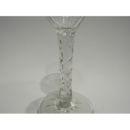 4407 - An 18th Century wine/cordial glass with facet stem, etched floral bowl with swag border.  13.7cm hig... 