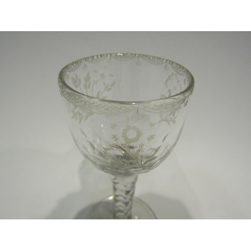 4407 - An 18th Century wine/cordial glass with facet stem, etched floral bowl with swag border.  13.7cm hig... 