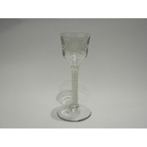 4409 - An 18th Century wine glass, circa 1760's, opaque twist stem, floral engraving to bowl.  14.5cm high.... 