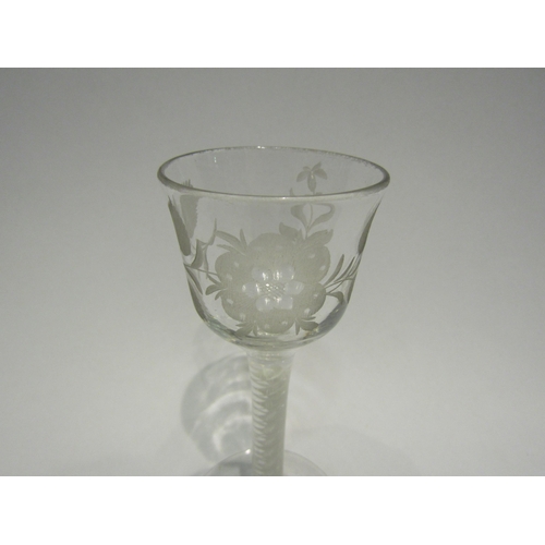 4409 - An 18th Century wine glass, circa 1760's, opaque twist stem, floral engraving to bowl.  14.5cm high.... 