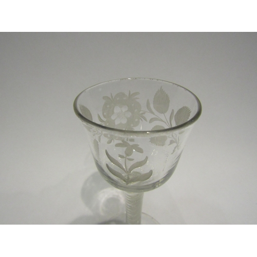 4409 - An 18th Century wine glass, circa 1760's, opaque twist stem, floral engraving to bowl.  14.5cm high.... 