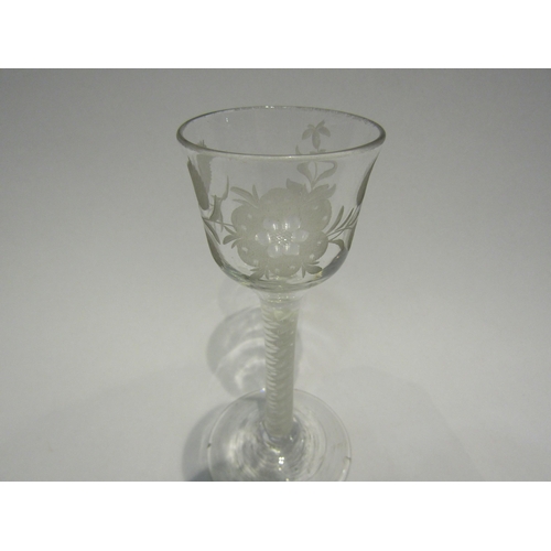 4409 - An 18th Century wine glass, circa 1760's, opaque twist stem, floral engraving to bowl.  14.5cm high.... 