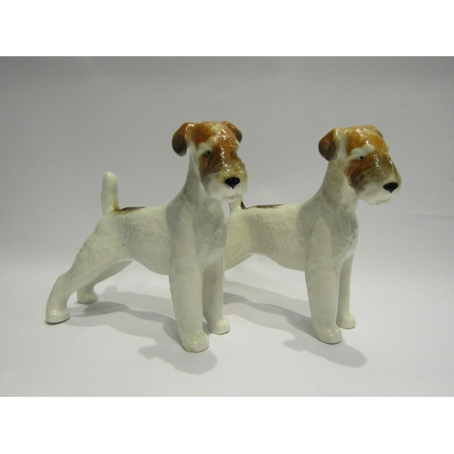 4410 - A pair of Russian ceramic terriers, both stamped USSR, 17cm tall