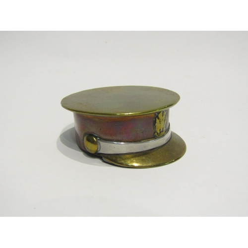 4428 - A brass, copper and white metal snuff box as a military cap