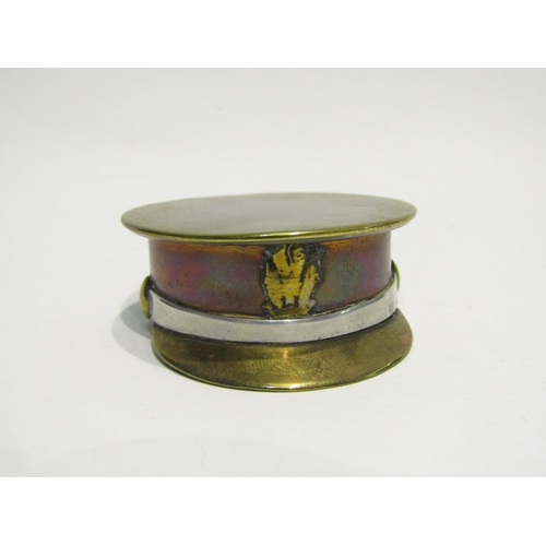 4428 - A brass, copper and white metal snuff box as a military cap