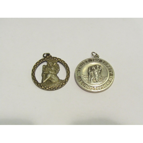 4431 - Two St. Christopher pendants, one silver the other stamped 