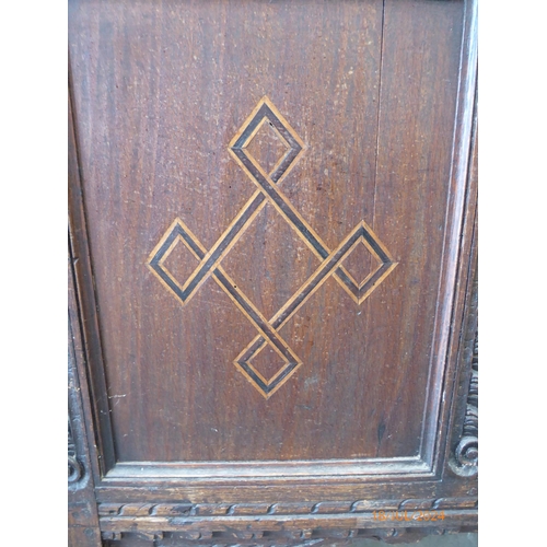 2239 - A Georgian inlaid oak coffer