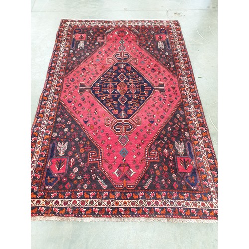 2243 - A hand woven Iranian blue and red rug 170cm x 260cm