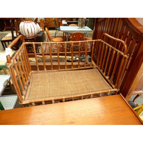 2396 - A vintage canework cot