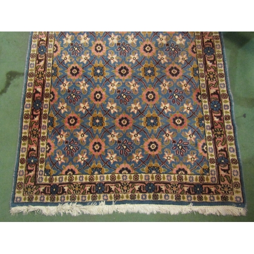 4194 - A blue ground rug, all-over pink and cream floral sprays, tasselled ends, 148cm x 98cm