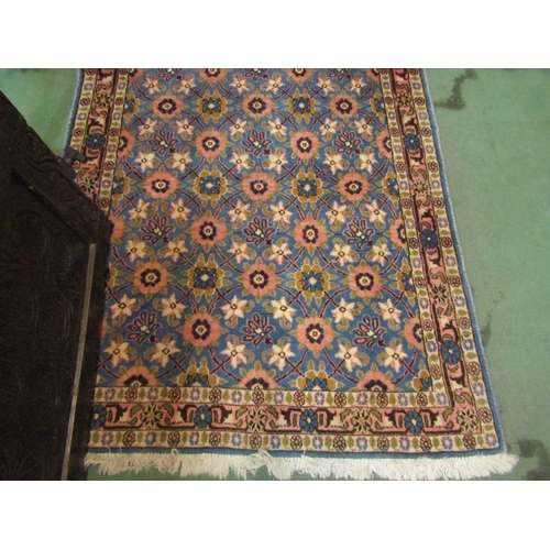 4194 - A blue ground rug, all-over pink and cream floral sprays, tasselled ends, 148cm x 98cm