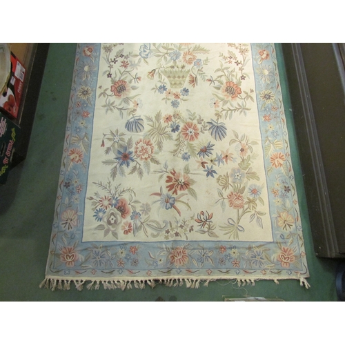 4221 - A Kashmir chain stitch floral design rug by A.S.Asmi & Co., label to reverse, blue border with tasse... 