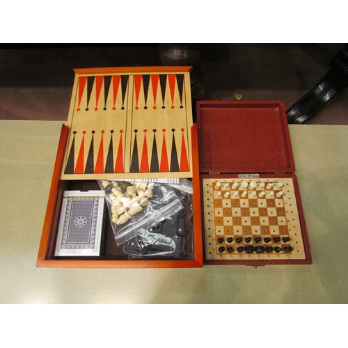 4231 - A K. & C. London travelling chess set, together with a wooden games compendium