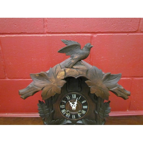 4242 - A German table cuckoo clock late 19th/early 20th Century. 40cm x 30cm, with key and pendulum