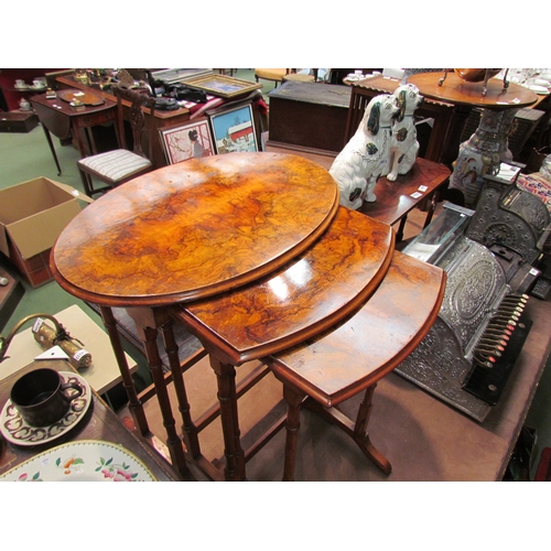 4253 - A burr walnut oval topped nest of three tables, tallest 61cm long x 40cm deep x 69cm high