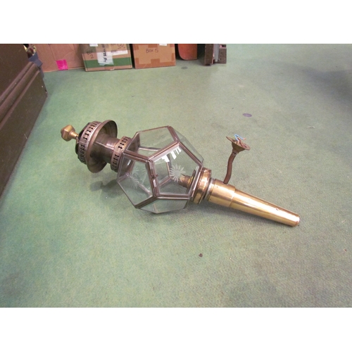 4256 - A 20th Century brass coaching/door lamp with star cut panels, 55.5cm total height